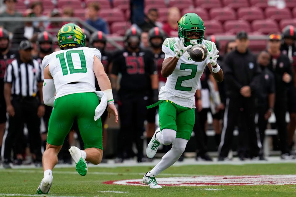 Oregon wide receiver Gary Bryant Jr. catches the ball tossed by quarterback Bo Nix, left, during the Sept. 30 game against Stanford.
