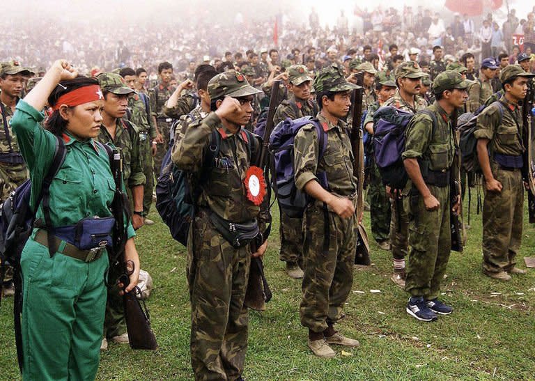 This picture taken on July 21, 2001, shows Maoist rebels as they parade in a village in eastern Nepal. A UN report released in October documented thousands of cases perpetrated during Nepal's civil war, which had claimed 16,000 lives by the time it came to an end in 2006