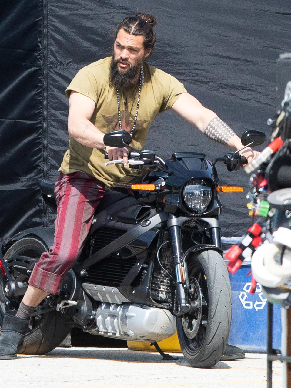 <p>Jason Momoa hops on his motorcycle to shoot scenes for <em>Slumberland</em> in Toronto on Friday.</p>