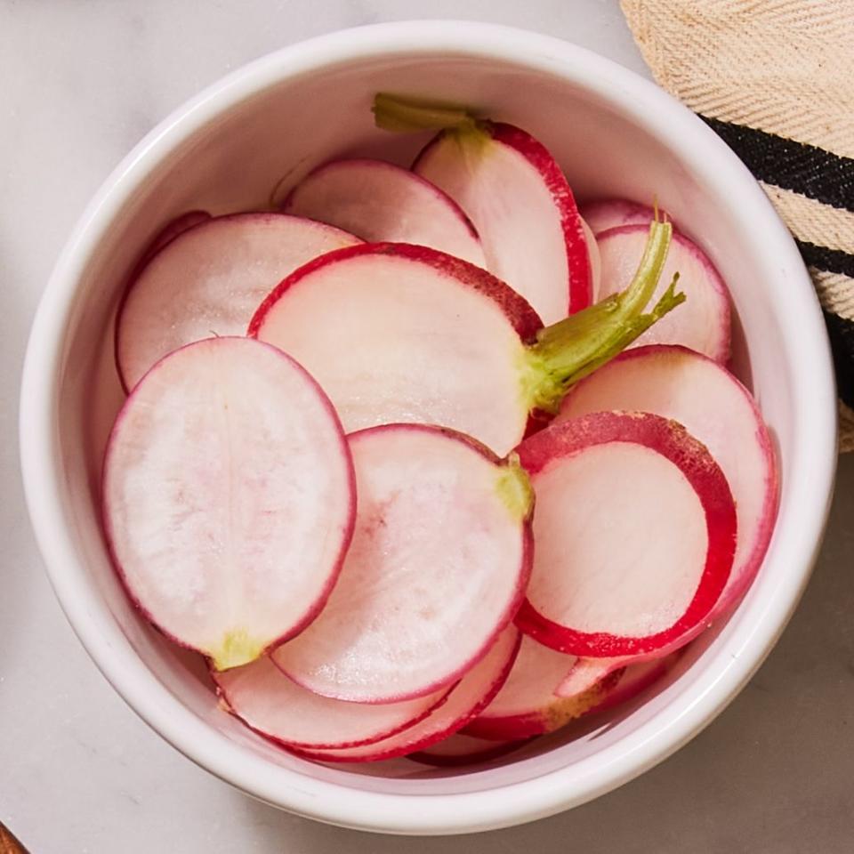 <p>Cool, crisp, and a bit peppery, sliced radishes are another traditional topping you might see on tacos.</p>
