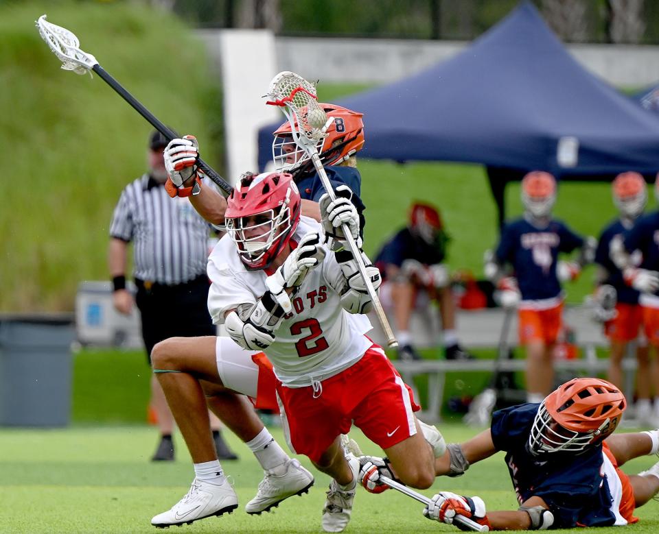 St. Andrew's player Jack Schulte (2) takes on  Benjamin High School in a Boys 1A Lacrosse State finals match up with at the Paradise Coast Sports Complex in Naples, Friday, May 7, 2022.