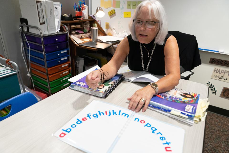 Karen Brantingham, reading specialist at Berryton Elementary School, shows an alphabet arc she learned to use after taking the state-funded LETRS literacy training.