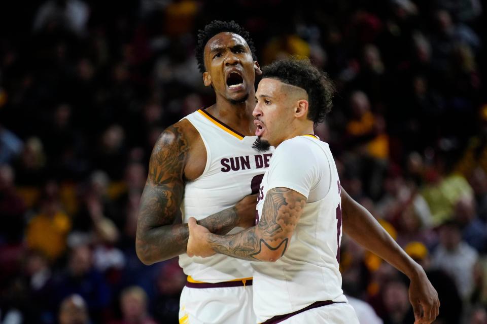 ASU guard Jose Perez (12) holds back center Shawn Phillips Jr. (9) from arguing with an official during a game against Colorado at Desert Financial Arena Jan. 6, 2024, in Phoenix, Arizona.