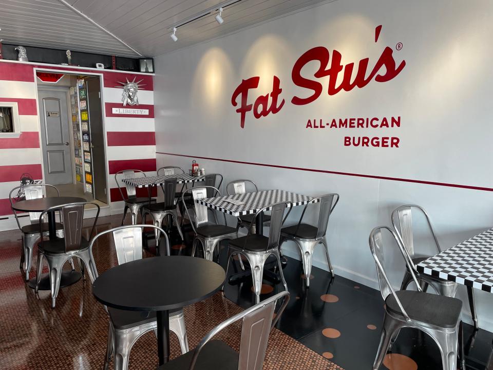 The dining room at Fat Stu's in Harrison. The 30-seat spot has a retro vibe complete with old license plates and pennies built into the floor. Photographed Oct. 27, 2023