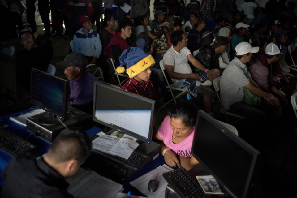 In this Nov. 27, 2018 photo, migrants who travel in a caravan attend a job fair to find work in Tijuana, Mexico. The previous week the job fair was only seeing 100 to 130 migrants each day, but the day after the Nov. 25 clash at the border more than 400 showed up, suggesting that the incident made migrants want to keep their options open. (AP Photo/Ramon Espinosa)