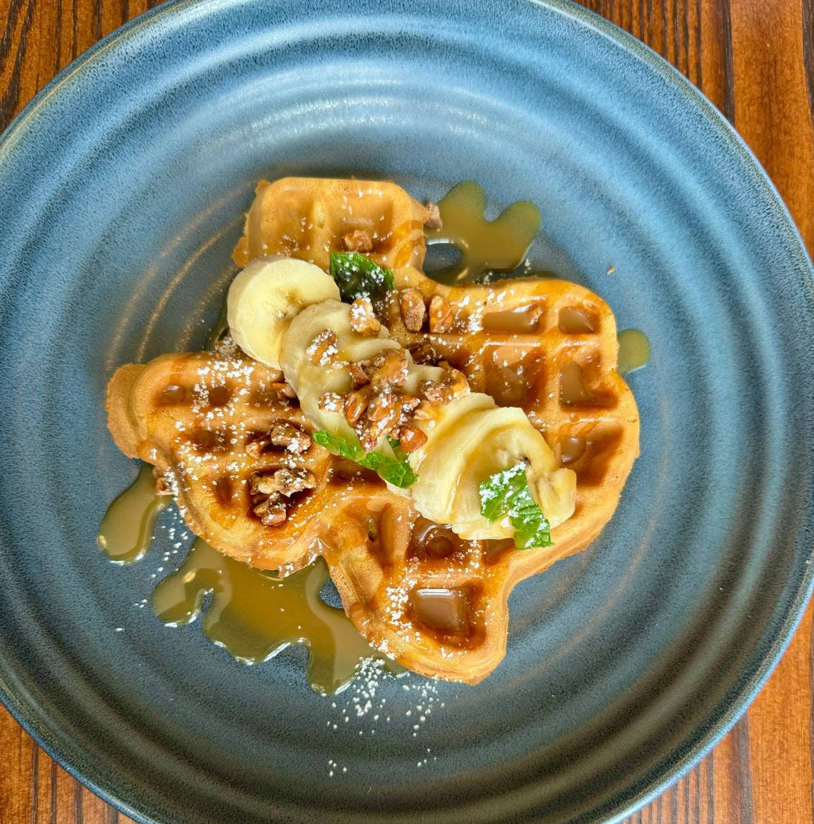 The Texas waffle with banana and caramel sauce at Second Bar + Grill in Mineral Wells, Texas, March 24, 2024. Bud Kennedy/bud@star-telegram.com