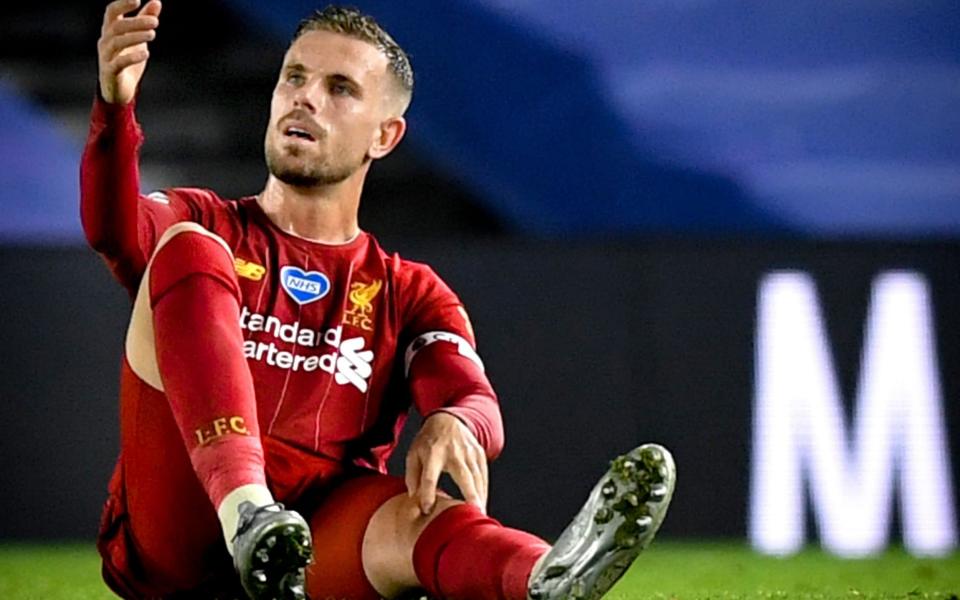 Jordan Henderson goes down injured - EPA