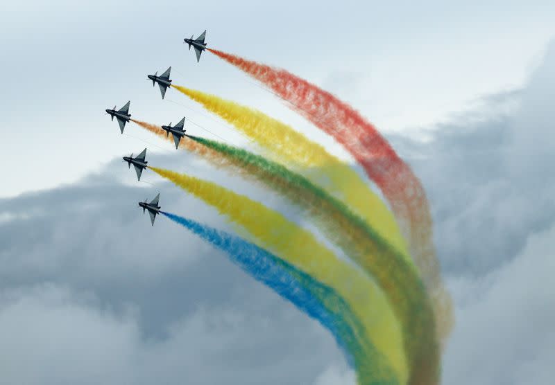 China's People's Liberation Army Air Force (PLAAF) Ba Yi aerobatics team perform an aerial display during a media preview of the Singapore Airshow in Singapore