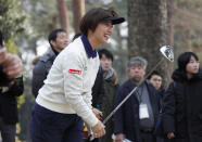 Japanese golf player Hiromi Kobayashi reacts after her shot during a media tour of Kasumigaseki Country Club golf course, one of the venues of the Tokyo 2020 Olympics, in Kawagoe, near Tokyo, Monday, Feb. 25, 2019. Kobayashi was the LPGA's rookie of the year in 1990 and she says Japan faces high expectations. She says "as a player I was representing myself. But this is a different kind of pressure" for the country and its golfing community. (AP Photo/Koji Sasahara)