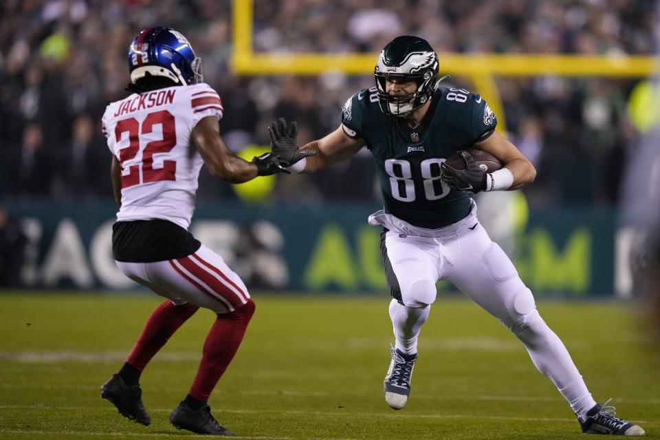 Philadelphia Eagles tight end Dallas Goedert (88) runs with the ball after making a catch as New York Giants cornerback Adoree' Jackson (22) tries to stop him during the first half of an NFL divisional round playoff football game, Saturday, Jan. 21, 2023, in Philadelphia. (AP Photo/Matt Slocum)