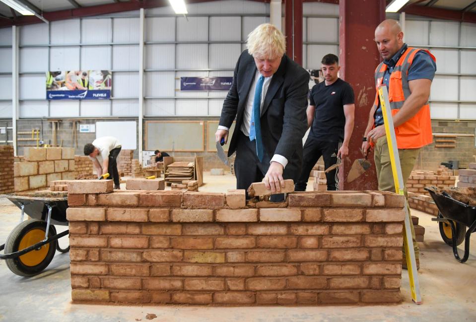 Mr Johnson did not wear a mask when he visited Exeter college(PA)