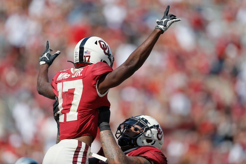 Oklahoma's Marvin Mims (17) celebrates with Marquis Hayes (54) after catching a touchdown during a college football game between the University of Oklahoma Sooners (OU) and the Kansas State Wildcats at Gaylord Family-Oklahoma Memorial Stadium, Okla., Saturday, Sept. 26, 2020.