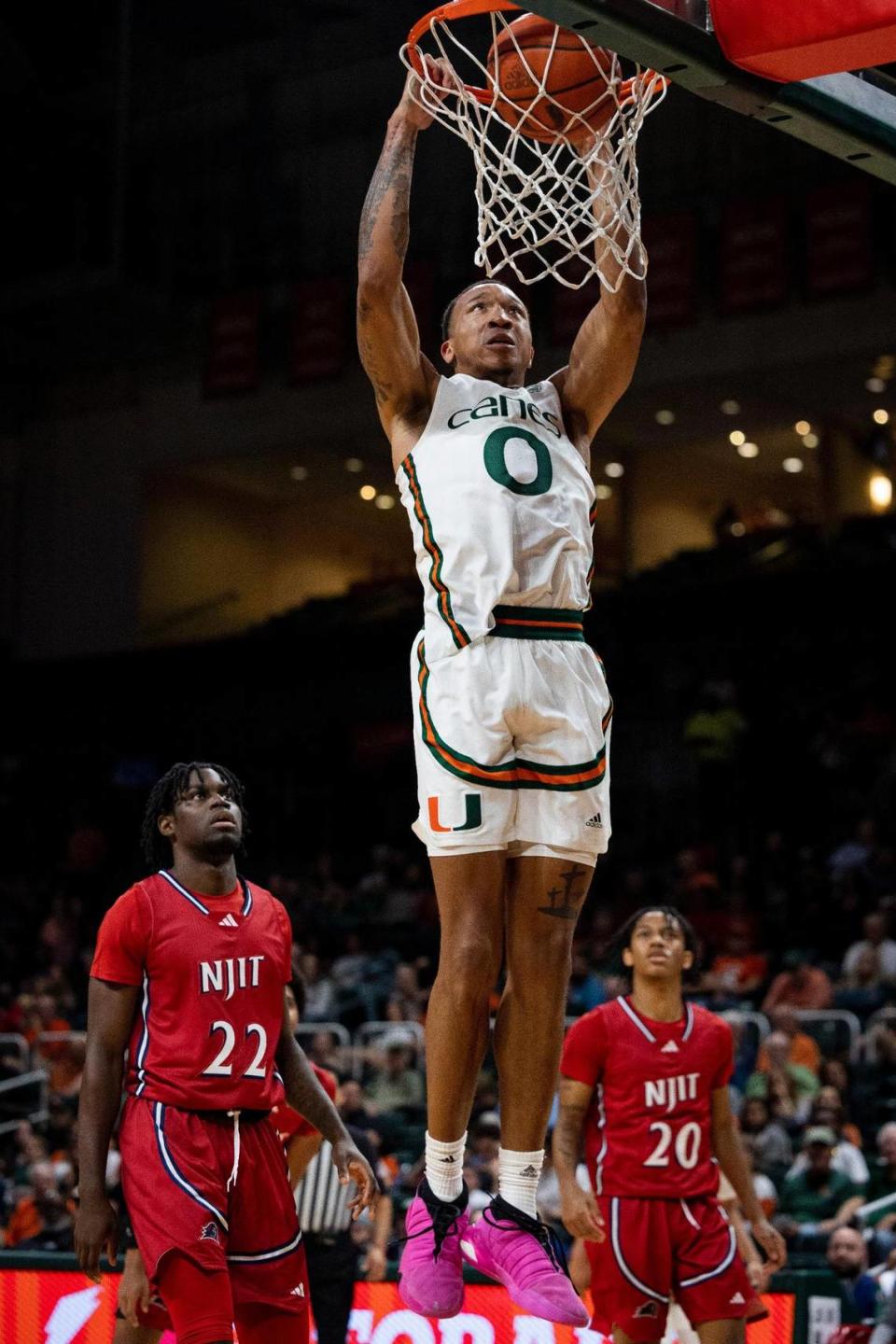 Miami Hurricanes guard Matthew Cleveland (0) dunks the ball during the first half of the Miami Hurricanes home opener against NJIT on Monday, Nov. 6, 2023, at the Watsco Center in Coral Gables.