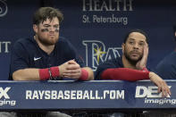 Boston Red Sox's Christian Arroyo, left, and Tommy Pham look on during the ninth inning of a baseball game against the Tampa Bay Rays Wednesday, Sept. 7, 2022, in St. Petersburg, Fla. (AP Photo/Chris O'Meara)