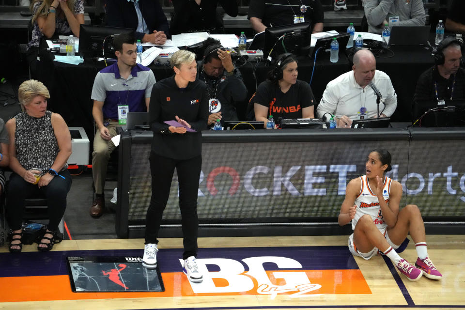 Jun 29, 2022; Phoenix, Arizona, USA; Phoenix Mercury head coach Vanessa Nygaard (left) and guard Skylar Diggins-Smith (4) look on against the Indiana Fever near a painted section of the court reading BG 42 in support of Phoenix Mercury center Brittney Griner (not pictured) during the first half at Footprint Center. Mandatory Credit: Joe Camporeale-USA TODAY Sports