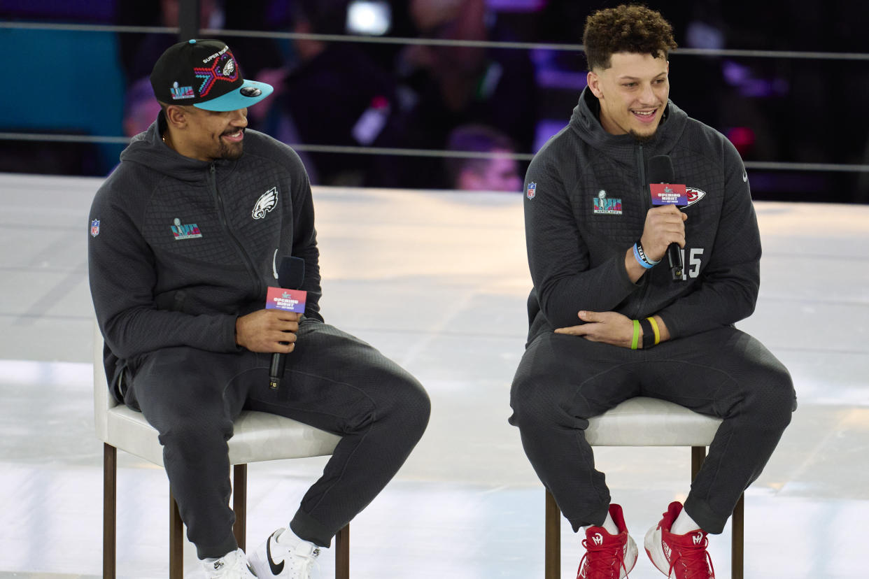 PHOENIX, AZ - FEBRUARY 06: Jalen Hurts #1 of the Philadelphia Eagles speaks with Patrick Mahomes #15 of the Kansas City Chiefs at Footprint Center on February 6, 2023 in Phoenix, Arizona. (Photo by Cooper Neill/Getty Images)