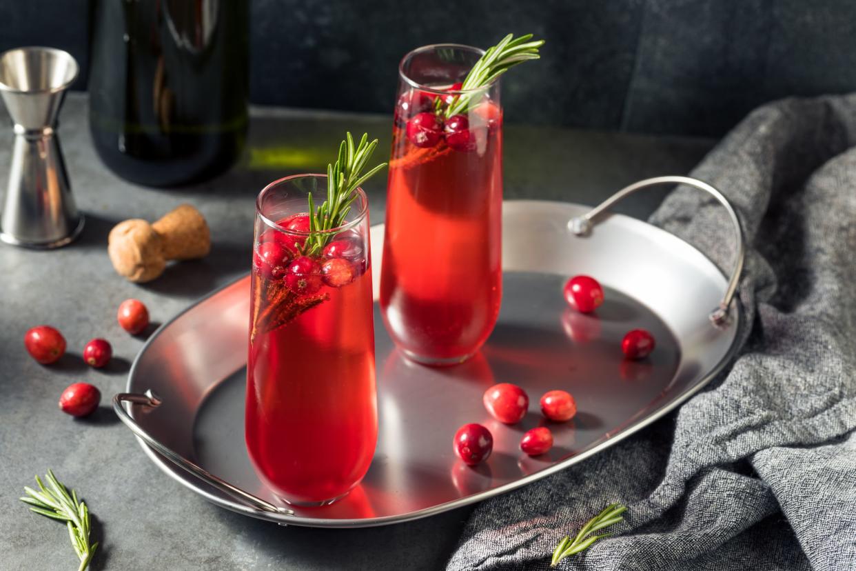 Boozy Holiday Cranberry Champagne Poinsettia Cocktail with Rosemary