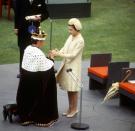 <p>Wearing a coordinated lemon look, the Queen is pictured here with Prince Charles at his Investiture as Prince of Wales.<br><i>[Photo: Rex]</i> </p>
