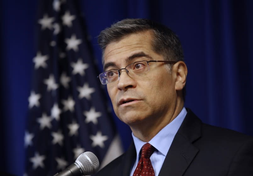 FILE - In this Dec. 4, 2019 file photo California Attorney General Xavier Becerra discusses settlements reached with 52 automobile parts manufacturers for illegal bid rigging during a news conference in Sacramento, Calif. Bacerra's office urged a state appeals court Thursday, Dec. 19, 2019 to refrain from ordering it to review and publicly release a massive trove of records documenting investigations into police shootings, use-of-force incidents and officer misconduct. (AP Photo/Rich Pedroncelli,File)