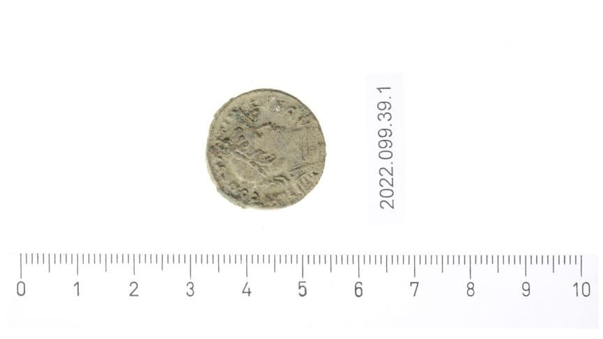 A coin dating back to the reign of Constantine I that was found near the watchtower.  The coin is just under 2cm  in width and has a side profile of a man on it.