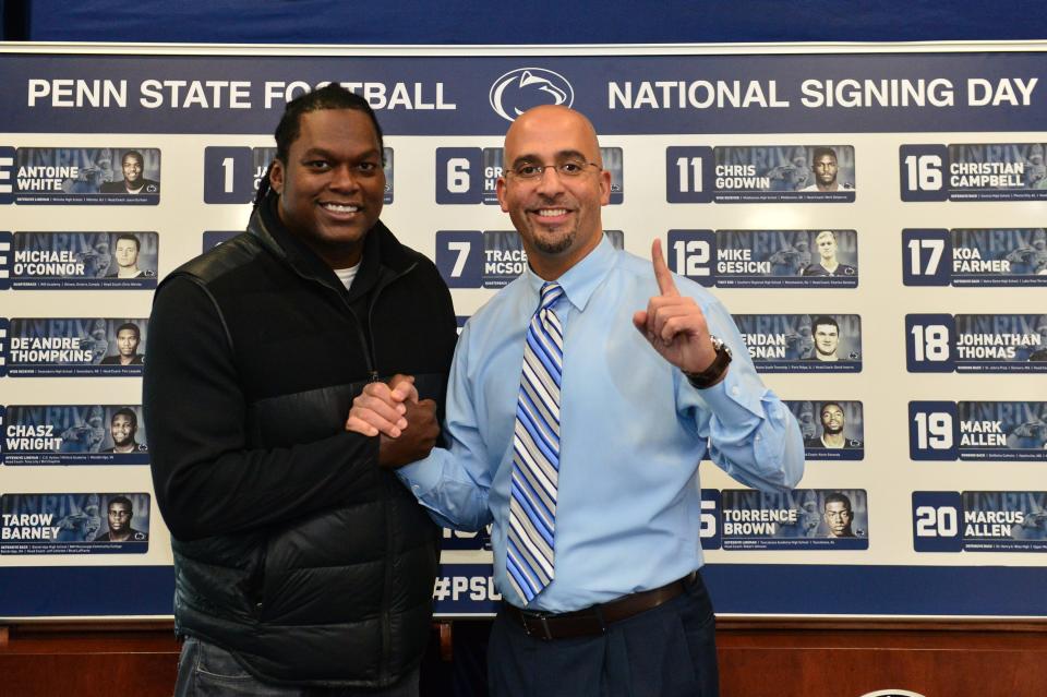 Penn State head coach James Franklin, right, poses for a photo with former Nittany Lion great LaVar Arrington in 2014.