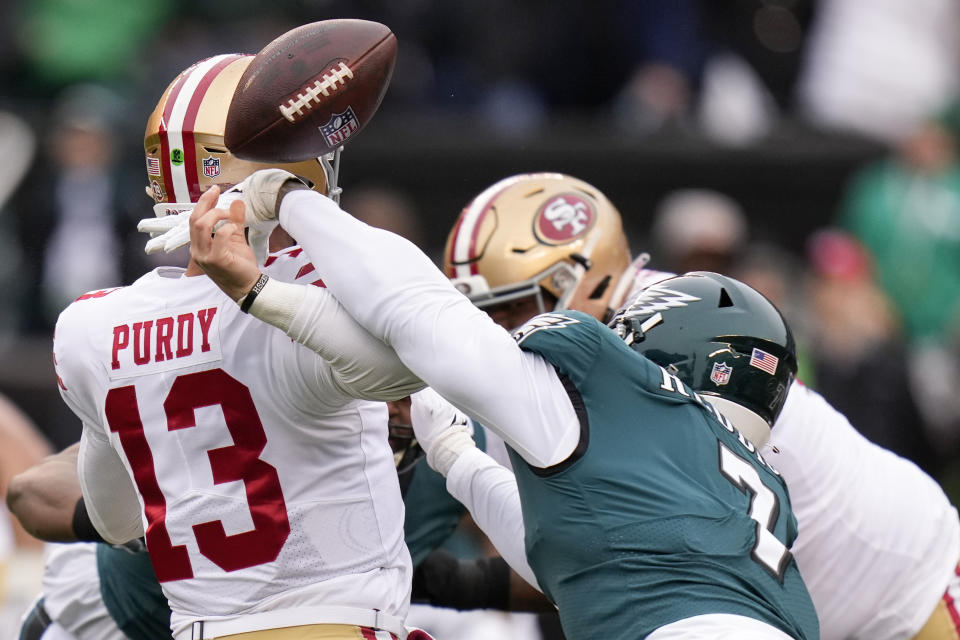 FILE - Philadelphia Eagles linebacker Haason Reddick, right, causes a fumble by San Francisco 49ers quarterback Brock Purdy during the first half of the NFC Championship NFL football game between the Philadelphia Eagles and the San Francisco 49ers on Jan. 29, 2023, in Philadelphia. Purdy's delayed surgery could happen early March 2023 if the swelling in his injured elbow has been reduced, general manager John Lynch said on Tuesday, Feb. 28, 2023. (AP Photo/Seth Wenig, File)