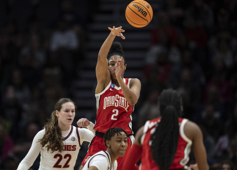 Ohio State forward Taylor Thierry (2) passes the ball against Virginia Tech guard Cayla King (22) during the first half of an Elite 8 college basketball game of the NCAA Tournament, Monday, March 27, 2023, in Seattle. (AP Photo/Stephen Brashear)