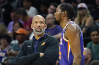 Phoenix Suns head coach Monty Williams, left, talks with Suns forward Kevin Durant, right, during the first half of an NBA basketball game against the Minnesota Timberwolves Wednesday, March 29, 2023, in Phoenix. (AP Photo/Ross D. Franklin)