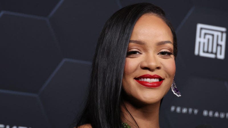 Rihanna poses for a picture as she celebrates her beauty brands Fenty Beauty and Fenty Skin on February 11, 2022 in Los Angeles, California.