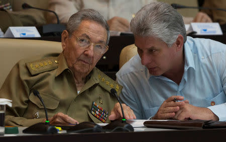 Cuba's President Raul Castro (L) chats with Cuba's Vice President Miguel Diaz-Canel react during the National Assembly in Havana, Cuba, July 8, 2016. Ismael Francisco/Courtesy of Cubadebate/Handout via Reuters.