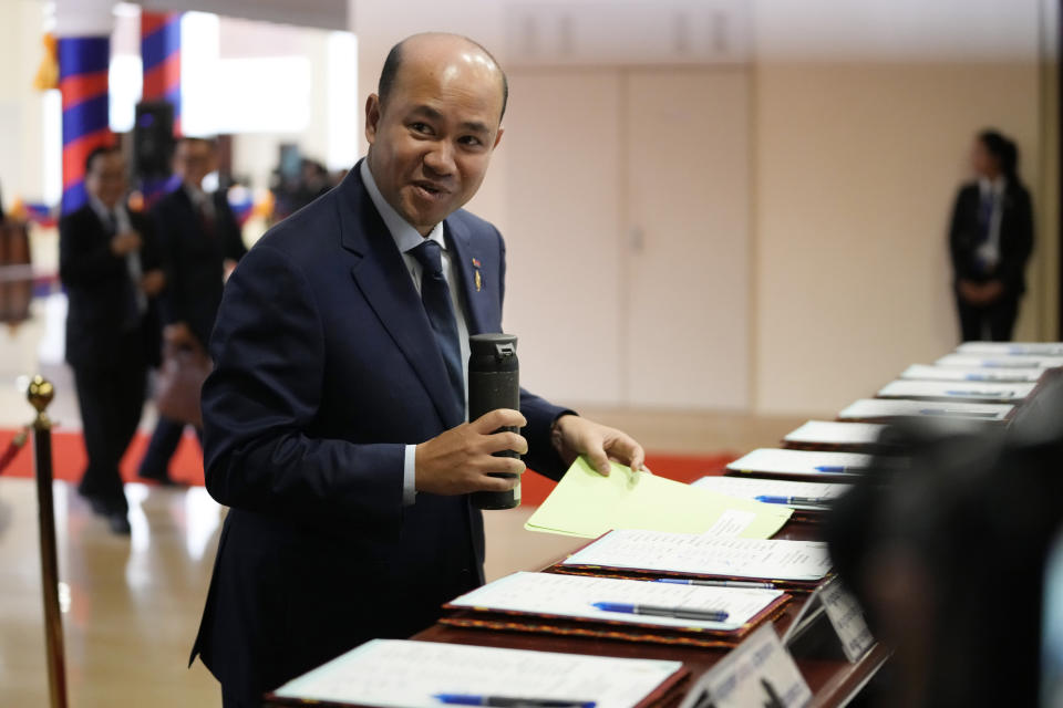 Cambodian People's Party lawmaker Hun Many, son of Prime Minister Hun Sen, registers before attending an assembly session in Phnom Penh, Cambodia, Tuesday, Aug. 22, 2023. (AP Photo/Heng Sinith)