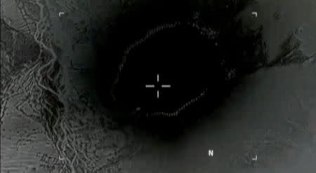 Still image taken from a video released by the U.S. Department of Defense on April 14, 2017 shows the moment the "mother of all bombs" struck the Achin district of the eastern province of Nangarhar, Afghanistan, bordering Pakistan where U.S. officials said a network of tunnels and caves was being used by militants linked to Islamic State. DVIDS/Handout via Reuters TV