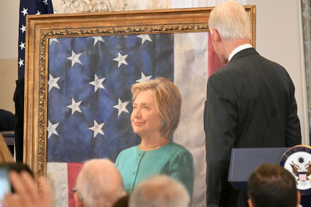 <p>MANDEL NGAN/AFP via Getty</p> Former President Bill Clinton looks at Hillary Clinton's official secretary of state portrait on Sept. 26, 2023