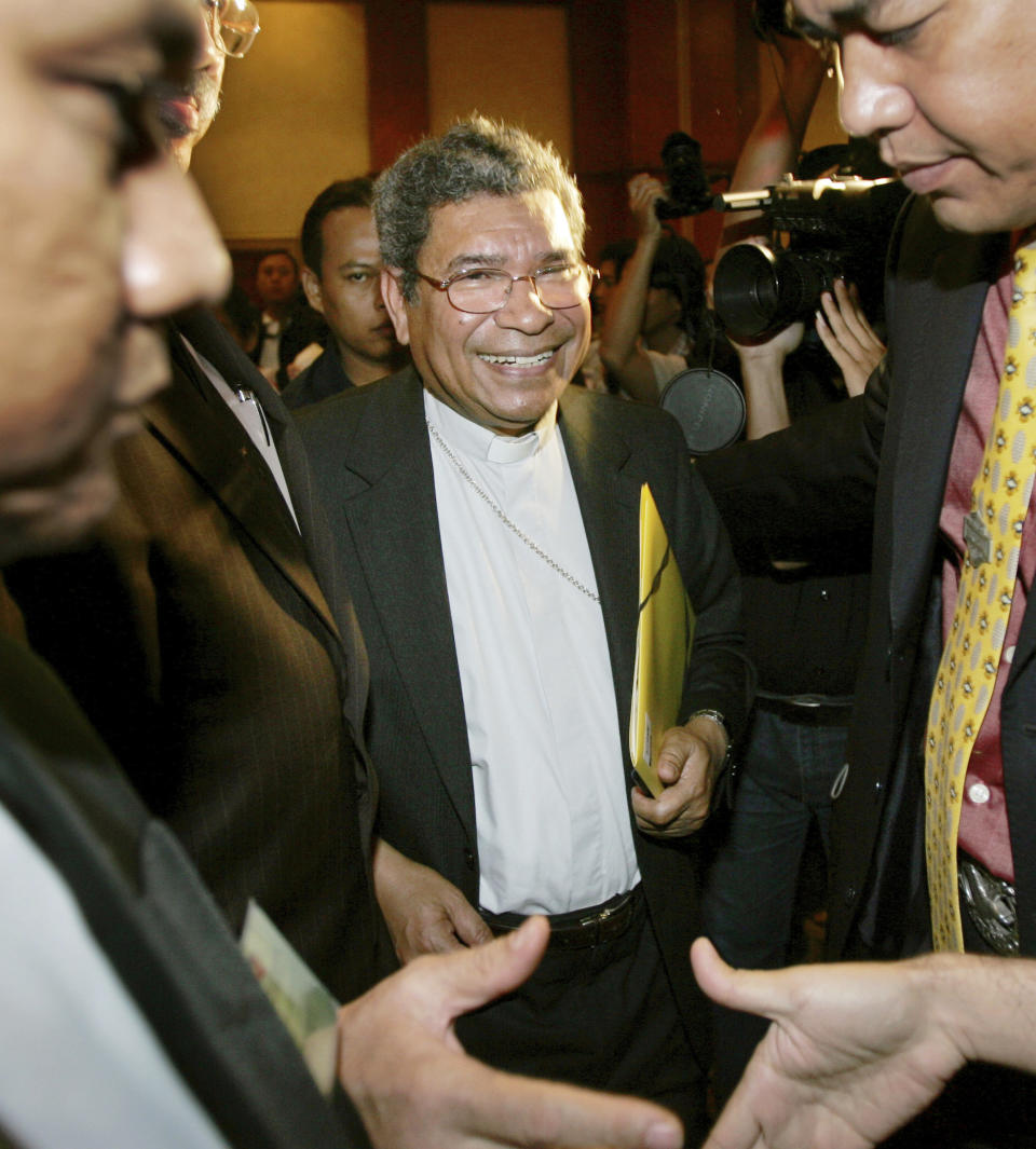 FILE - Nobel peace laureate Bishop Carlos Ximenes Belo leaves after a Commission on Truth and Friendship hearing in Jakarta, Indonesia, on March 26, 2007. Belo has been accused in a Dutch magazine article of sexually abusing boys in East Timor in the 1990s, rocking the Catholic Church in the impoverished nation and forcing officials at the Vatican and his religious order to scramble to provide answers. (AP Photo/Dita Alangkara, File)