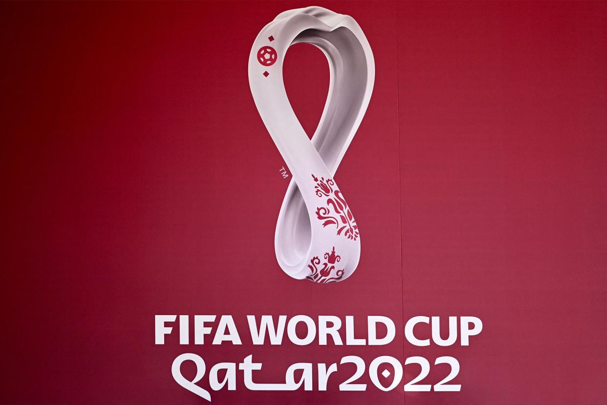 The logo of the Qatar 2022 FIFA World Cup football tournament is displayed on a wall in Doha on October 23, 2022