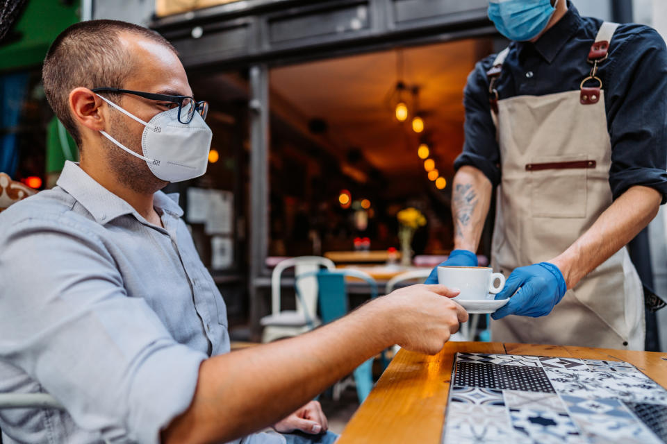 Restaurants have embraced multiple safety measures to stay open. If diners want their favorite spots to remain open amid the pandemic, masking up when interacting with staff is the least they can do. (Photo: urbazon via Getty Images)