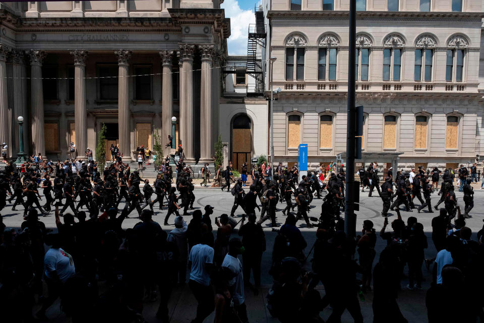 Members of an all black militia, march during a rally to protest the killing of Breonna Taylor, in Louisville, Kentucky on July 25, 2020.<span class="copyright">Jeff Dean—AFP—Getty Images</span>