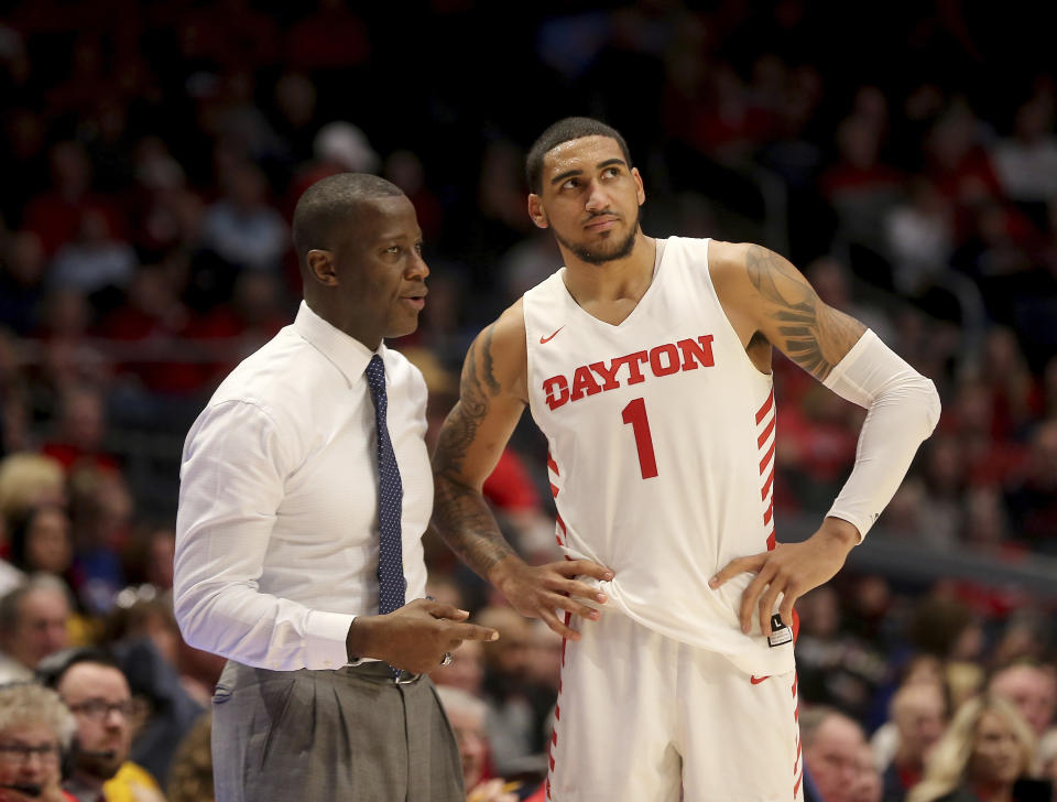 Dayton head coach Anthony Grant, left, talks with Obi Toppin during the second half of an NCAA college basketball game against Fordham, Saturday, Feb. 1, 2020, in Dayton, Ohio. (AP Photo/Tony Tribble)
