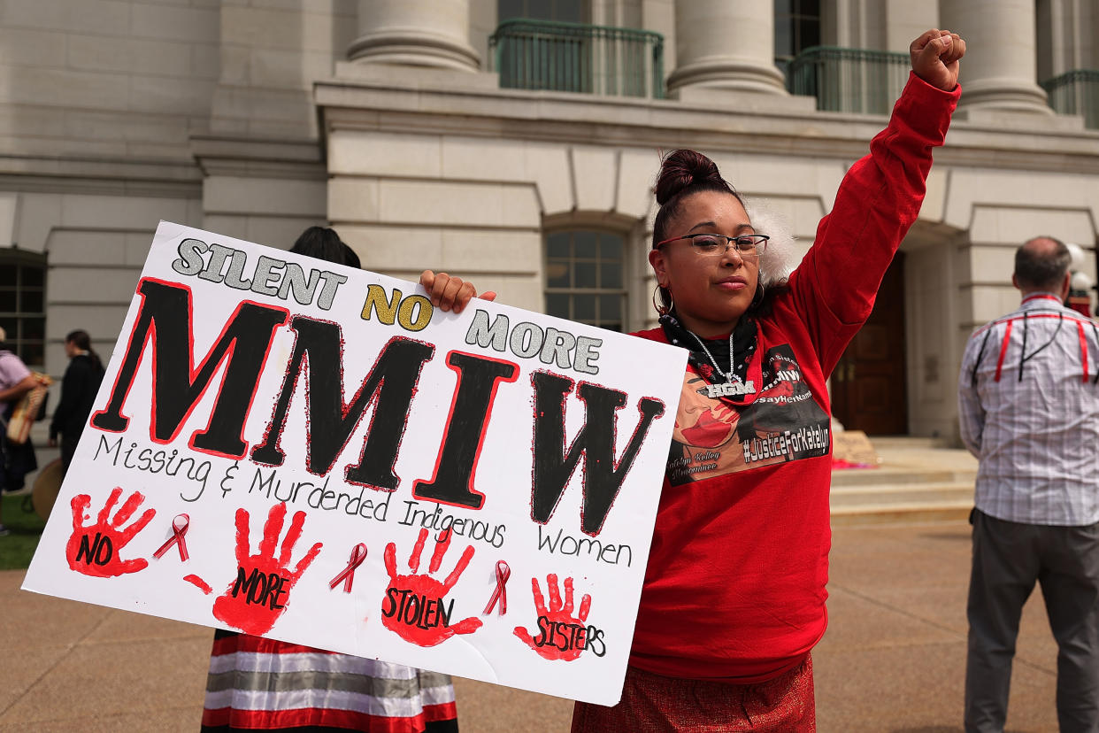 A demonstrator in Madison, Wis., holds a sign to commemorate missing and murdered Indigenous women and girls
