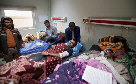 Displaced people who were injured in clashes and fled from Islamic State militants in Mosul, receive treatment at a hospital west of Erbil, Iraq, November 25, 2016. REUTERS/Azad Lashkari