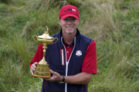 Team USA captain Steve Stricker poses with the trophy after the Ryder Cup matches at the Whistling Straits Golf Course Sunday, Sept. 26, 2021, in Sheboygan, Wis. (AP Photo/Ashley Landis)