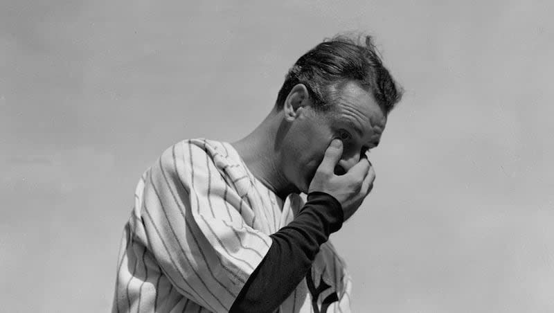 New York Yankees' Lou Gehrig, the "Iron Horse," wipes away a tear while speaking during a sold-out tribute at Yankee Stadium July 4, 1939. Gehrig's record-breaking career was cut short by neuromuscular disease.
