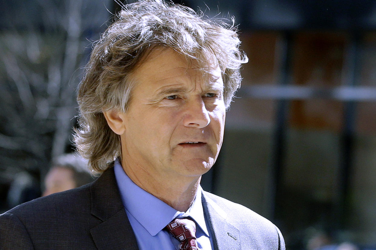 FILE - Jovan Vavic, a former University of Southern California water polo coach, arrives at federal court in Boston on March 25, 2019, to face charges in a nationwide college admissions bribery scandal. During closing arguments in Vavic's trial on Thursday April 7, 2022, his lawyer, Stephen Larson, said that the 60-year-old, who guided USC's men's and women's water polo teams to 16 national championships, was always acting in the best interests of the school and his team, never lied and never took a bribe. (AP Photo/Steven Senne, File)