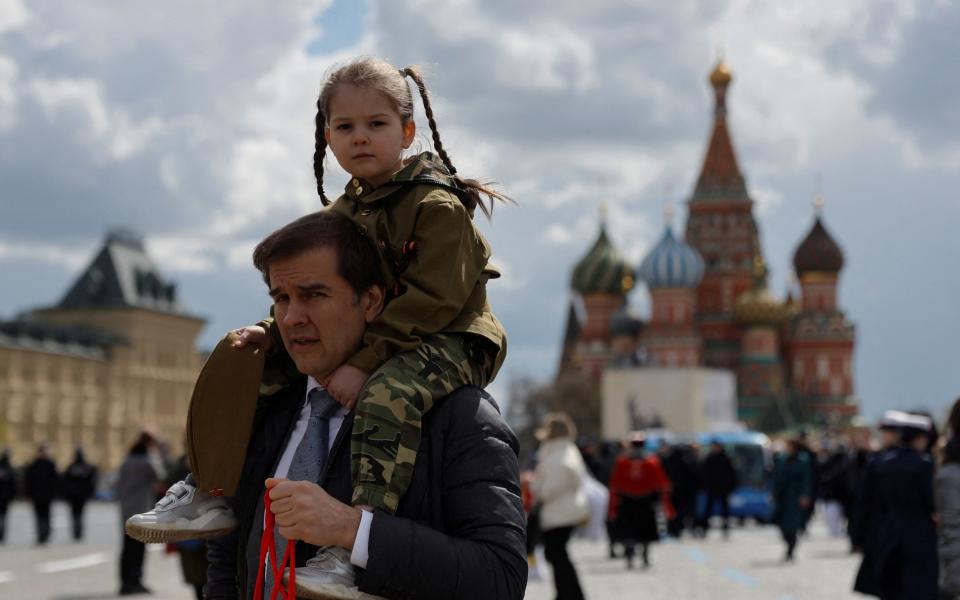 Spectators gather in Red Square after a military parade on Victory Day, which marks the 77th anniversary of the victory over Nazi Germany in World War Two, in central Moscow, Russia May 9, 2022 - Maxim Shemetov/Reuters