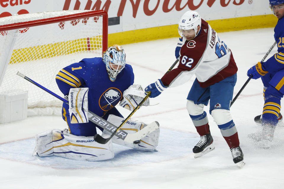 Buffalo Sabres goaltender Ukko-Pekka Luukkonen (1) stops Colorado Avalanche left wing Artturi Lehkonen (62) during the third period of an NHL hockey game, Thursday, Dec. 1, 2022, in Buffalo, N.Y. (AP Photo/Jeffrey T. Barnes)