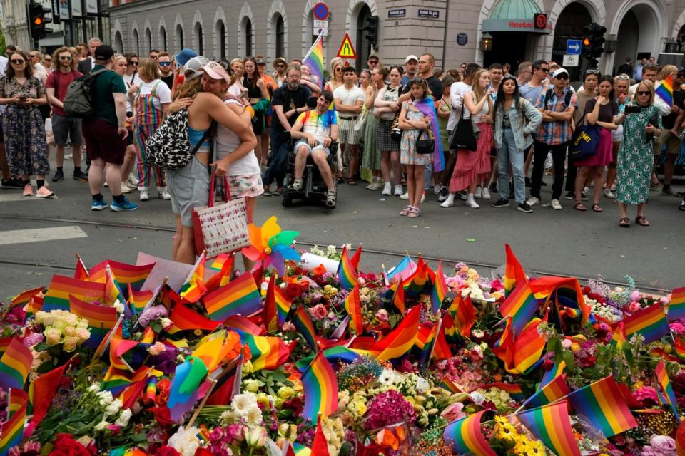 People laid flowers in tribute to the victims (AP)