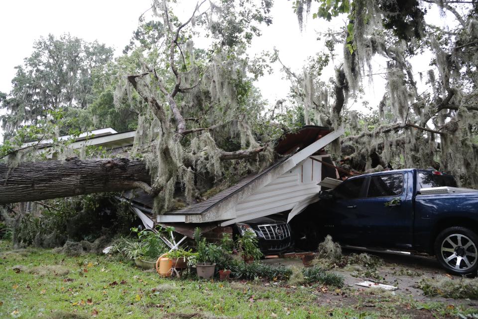 A large oak tree fell on the carport at a Windsor Forest home as Hurricane Idalia moved through Georgia on Aug. 30, 2023.