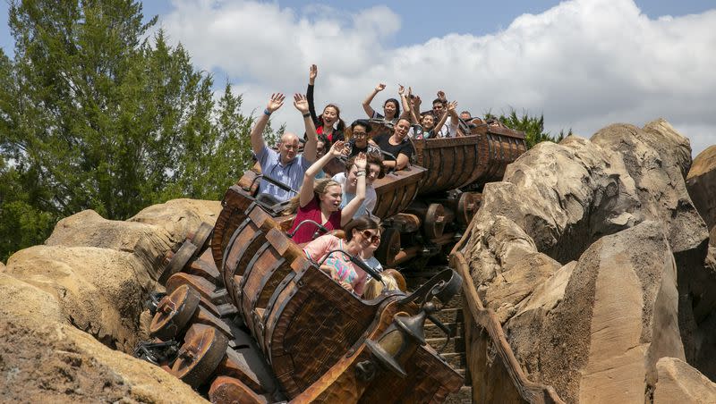 People ride the Seven Dwarfs Mine Train roller coaster at Magic Kingdom Park at Walt Disney World Resort in Lake Buena Vista, Florida, on Friday, April 22, 2022. A man traveled to all 12 Disney theme parks in 12 days in what he’s calling the “Global Disney Challenge.”