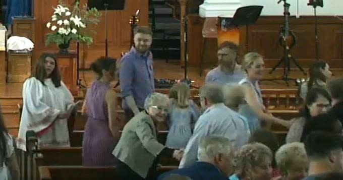 <strong><em>Members pass the peace at First Broad Street May 5, 2024 — the first Sunday service after the General Conference concluded. (First Broad Street UMC)</em></strong>