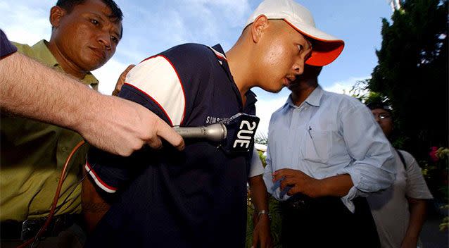 A 21-year-old Andrew Chan is led into Denpasar Police Headquarters shortly after his 2005 arrest. Photo: AAP